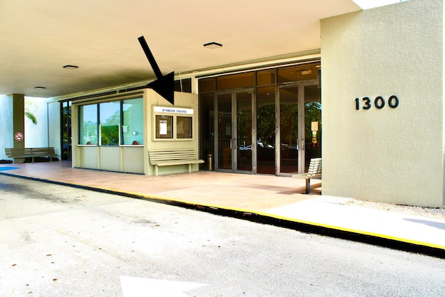 view of exterior entry featuring french doors