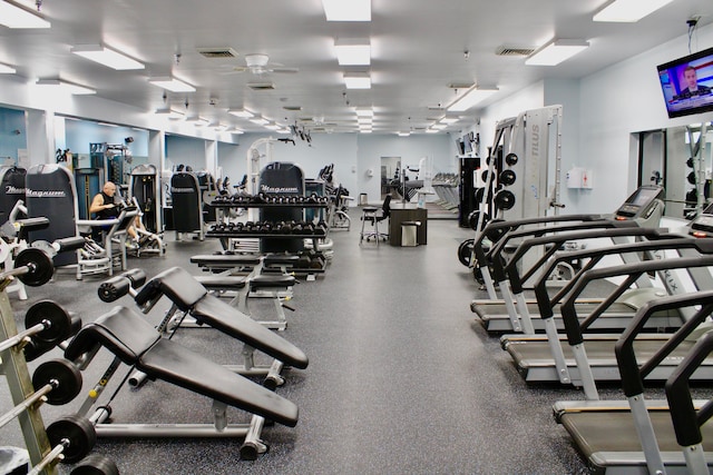 exercise room with ceiling fan