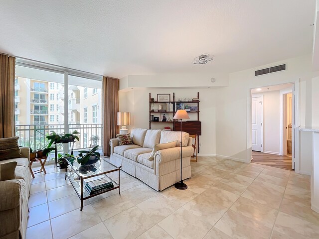 tiled living room with expansive windows