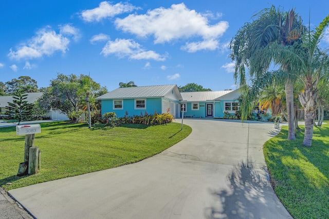 ranch-style home with a front yard