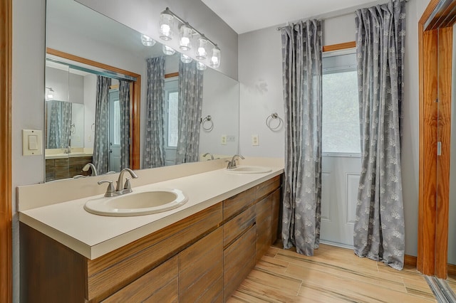 bathroom featuring vanity and hardwood / wood-style floors