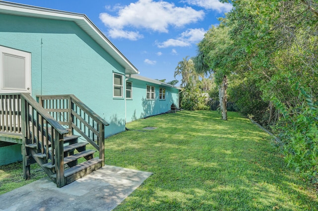 view of yard with a wooden deck