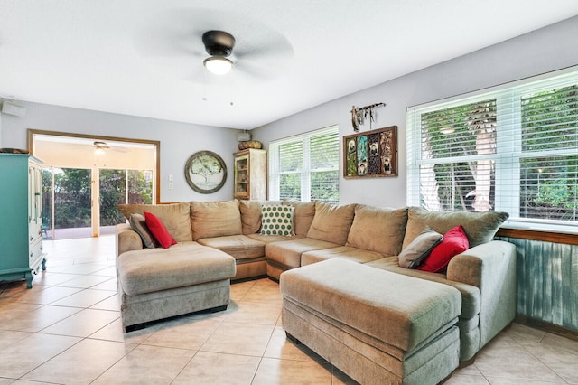 living room with ceiling fan and light tile patterned floors