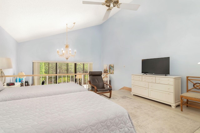 bedroom featuring high vaulted ceiling and ceiling fan with notable chandelier