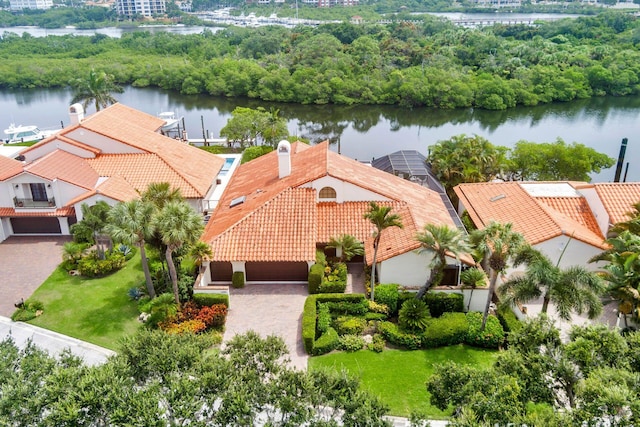 birds eye view of property with a water view