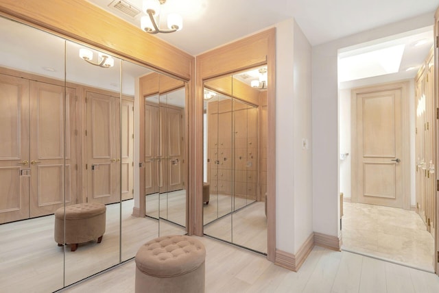 bathroom with a chandelier