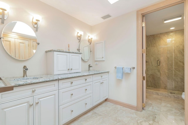 bathroom featuring vanity and walk in shower