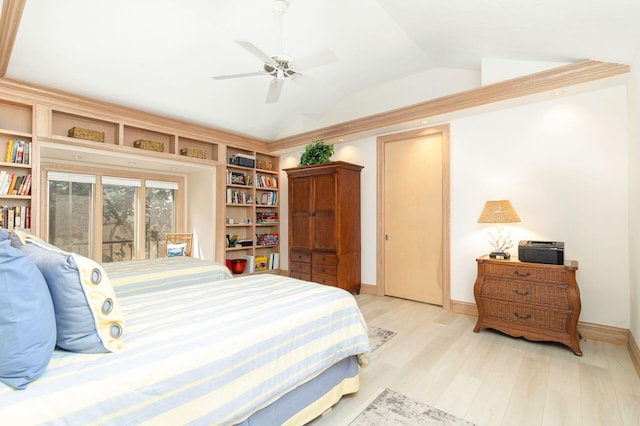 bedroom featuring ceiling fan, light hardwood / wood-style flooring, and vaulted ceiling