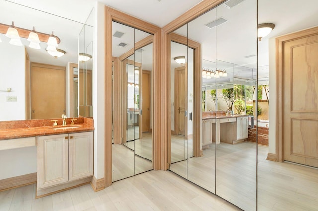 doorway featuring light hardwood / wood-style flooring and sink