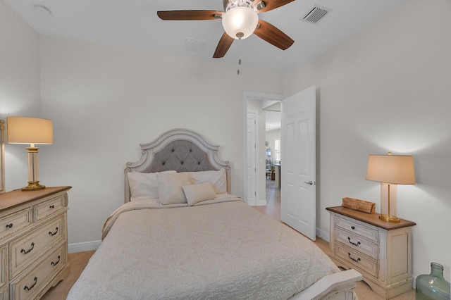 bedroom with light hardwood / wood-style flooring and ceiling fan