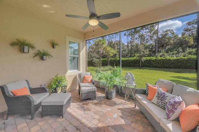 sunroom with ceiling fan