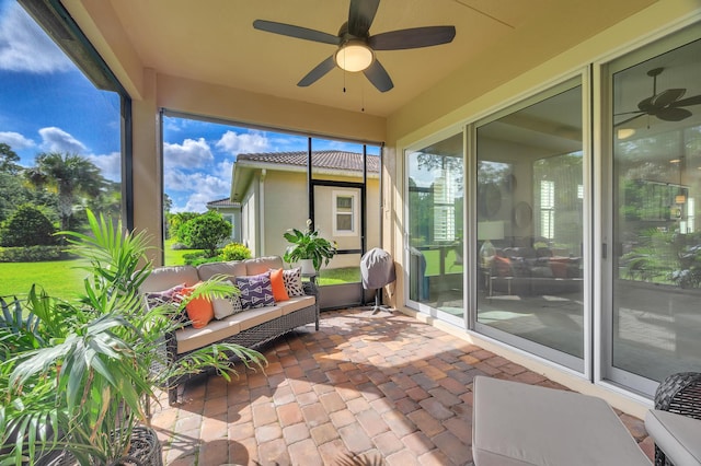 sunroom / solarium with ceiling fan