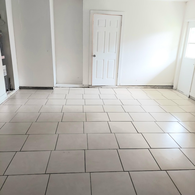 spare room featuring light tile patterned floors