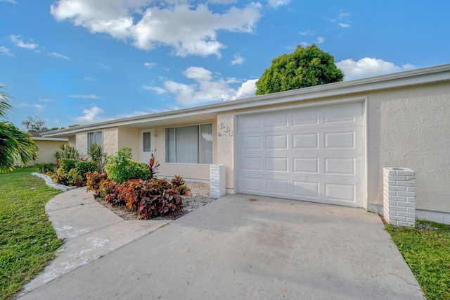 ranch-style house featuring a garage