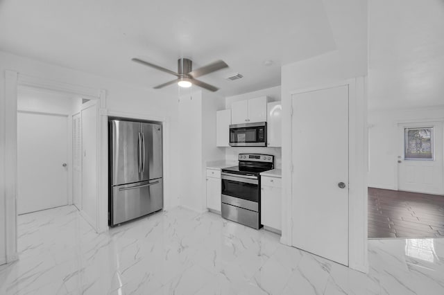 kitchen featuring white cabinets, stainless steel appliances, and ceiling fan