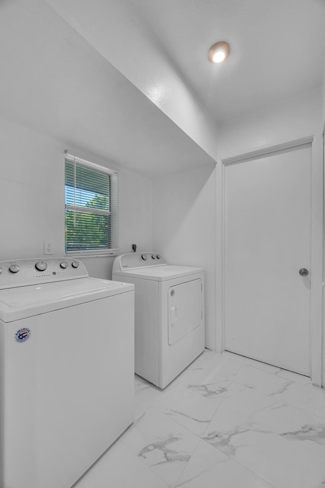 laundry area featuring washing machine and clothes dryer