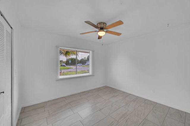 spare room featuring ceiling fan