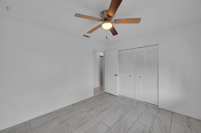 unfurnished bedroom with a closet and ceiling fan