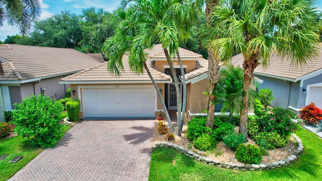 mediterranean / spanish-style house featuring a garage