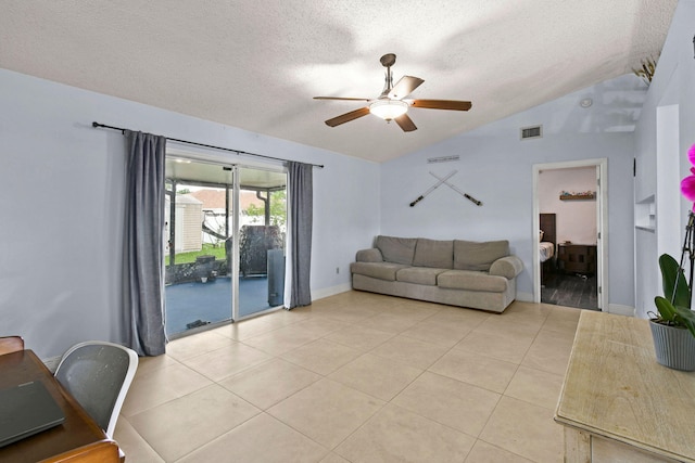 living room featuring lofted ceiling, light tile patterned flooring, a textured ceiling, and ceiling fan