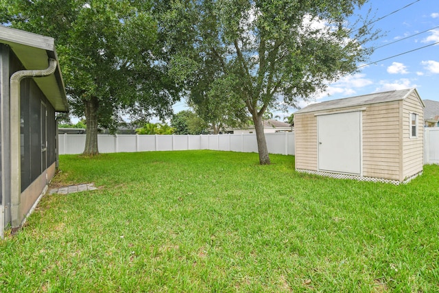 view of yard featuring a storage unit