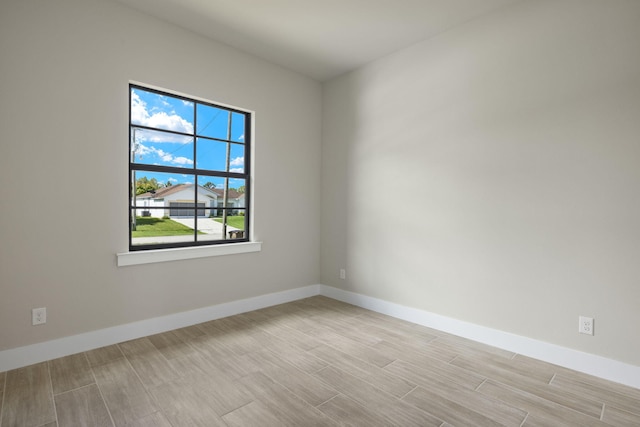 spare room featuring light wood-type flooring