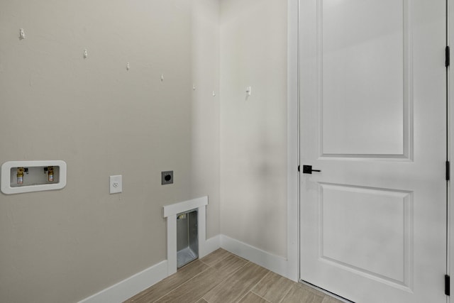 laundry room featuring hookup for an electric dryer, washer hookup, and light hardwood / wood-style floors