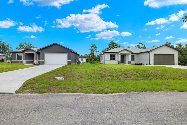 single story home with a front yard and a garage