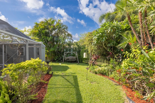 view of yard featuring glass enclosure