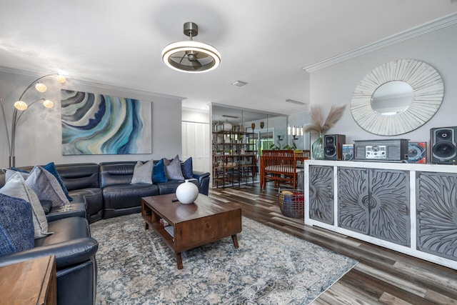 living room featuring crown molding and hardwood / wood-style floors