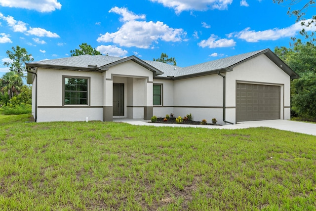 ranch-style home with a front yard and a garage