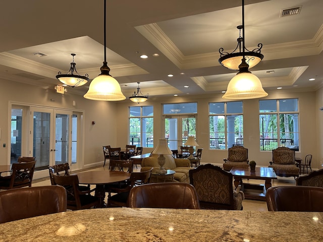 dining room featuring french doors, a healthy amount of sunlight, and crown molding