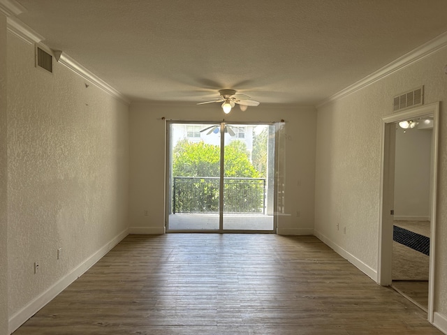 unfurnished room featuring ceiling fan, ornamental molding, dark hardwood / wood-style floors, and a textured ceiling