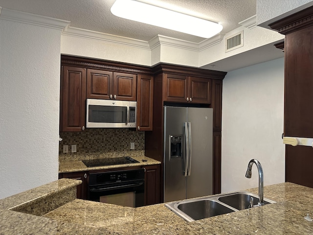 kitchen with sink, backsplash, black appliances, crown molding, and dark brown cabinets