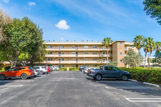 view of property featuring uncovered parking