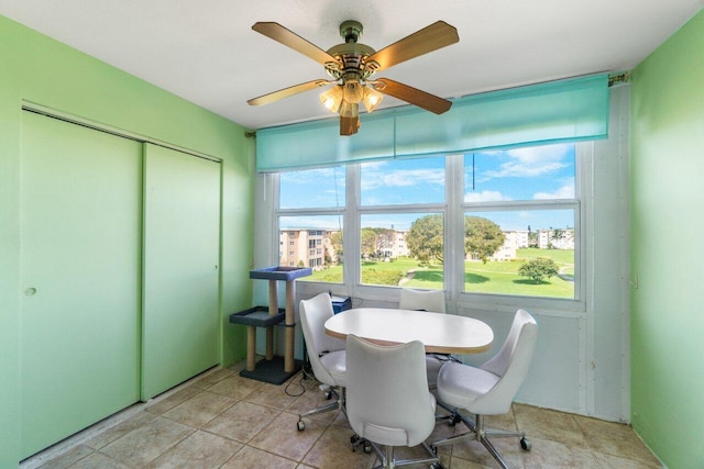 dining room featuring ceiling fan and light tile patterned floors