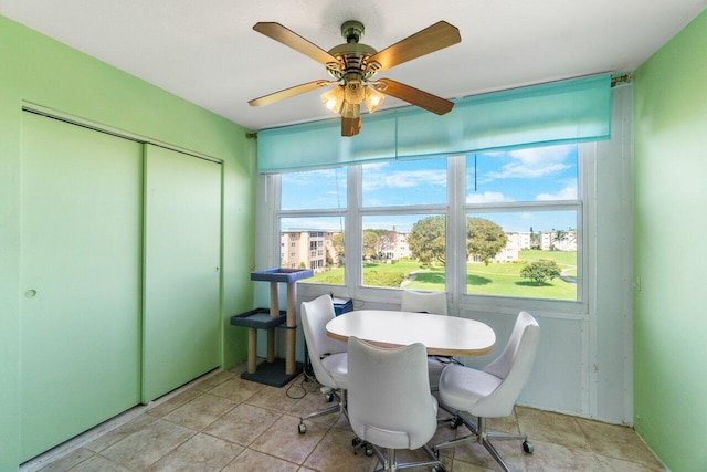sunroom / solarium featuring ceiling fan