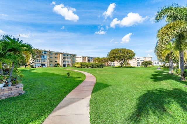 surrounding community with a yard