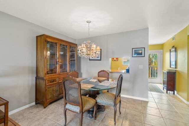 dining room with light tile patterned floors, baseboards, visible vents, and an inviting chandelier