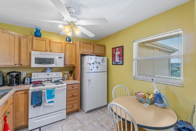 kitchen with light tile patterned flooring, ceiling fan, and white appliances