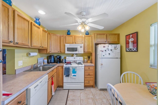 kitchen featuring light tile patterned floors, white appliances, a sink, a ceiling fan, and light countertops