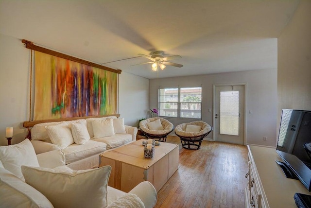 living room featuring ceiling fan and light wood-type flooring