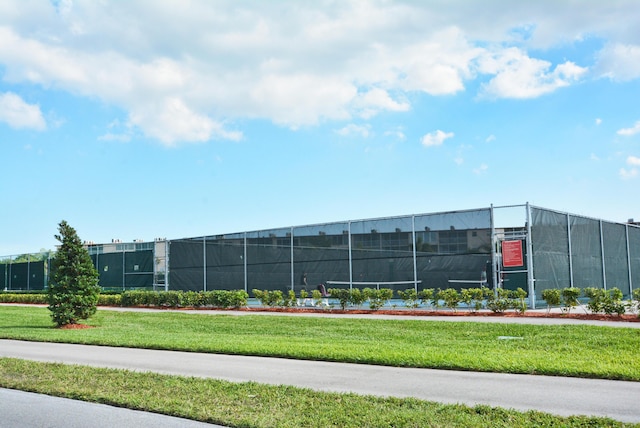 view of property with fence