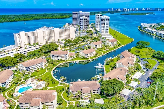 birds eye view of property featuring a water view and a city view