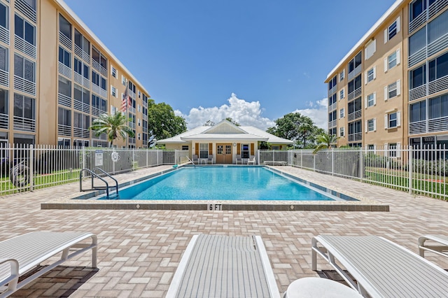 view of swimming pool featuring a patio area