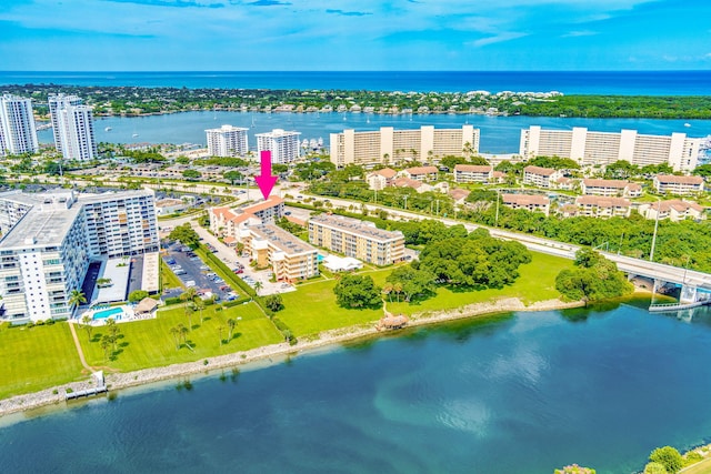 drone / aerial view featuring a water view and a city view