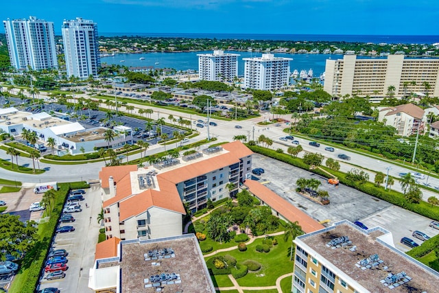 birds eye view of property featuring a view of city and a water view