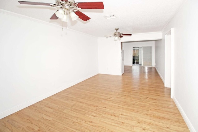 unfurnished room featuring ornamental molding, a textured ceiling, ceiling fan, and light wood-type flooring