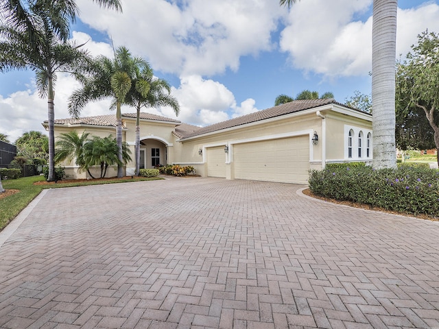 mediterranean / spanish-style house featuring a garage