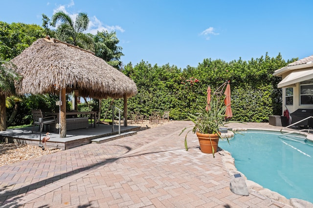 view of swimming pool featuring a gazebo and a patio area